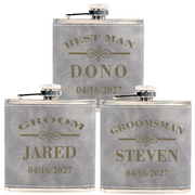 Three gray flasks with personalized names and dates on a white background