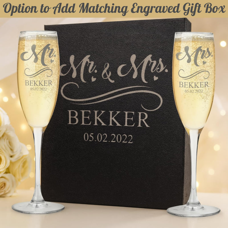 Personalized champagne flutes and box with 'Mr & Mrs BEKKER' text on a decorative background.