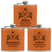 Three orange leather flasks with engraved names and dates on a white background