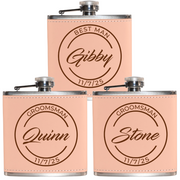 Three pink flasks with engraved names and dates on a white background