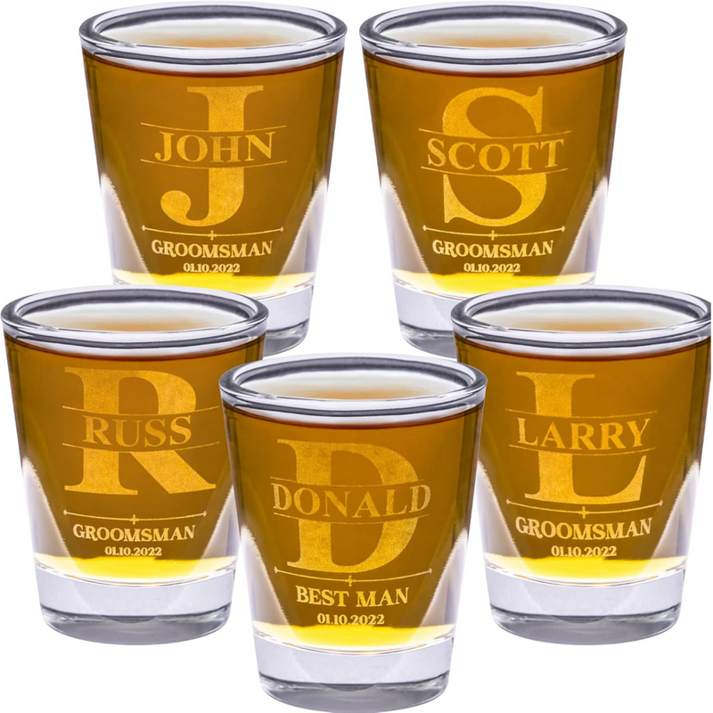Five shot glasses with engraved names and roles on a white background
