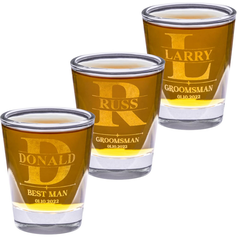 Three shot glasses with engraved names and dates on a white background