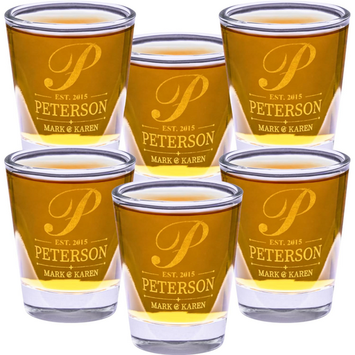 Set of six personalized shot glasses with 'Peterson' engraving on a white background