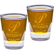 Two shot glasses with 'P' and 'Peterson' engraving on a white background
