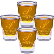 Four shot glasses with 'Peterson' branding on a white background