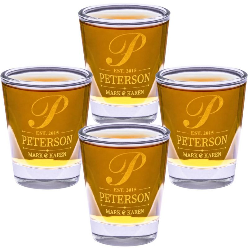 Four shot glasses with 'Peterson' branding on a white background