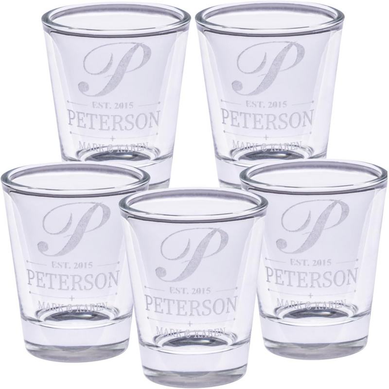 Set of five clear shot glasses with 'Peterson' branding on a white background