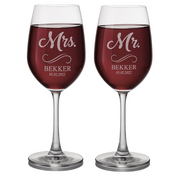 Two wine glasses with 'Mr.' and 'Mrs.' engraved names on a white background