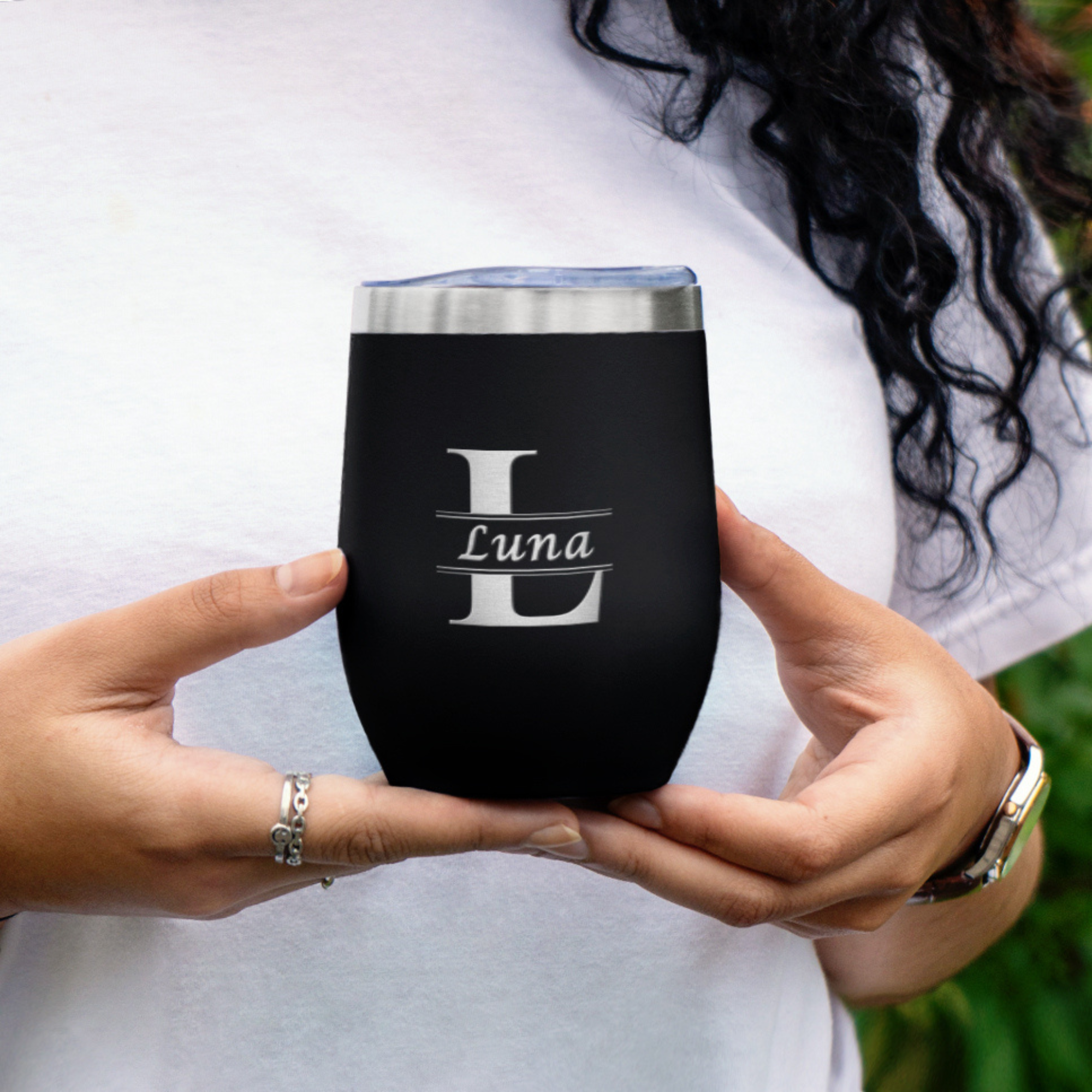 https://giftsinscribed.com/wp-content/uploads/Girl-holding-black-engraved-wine-tumbler.png